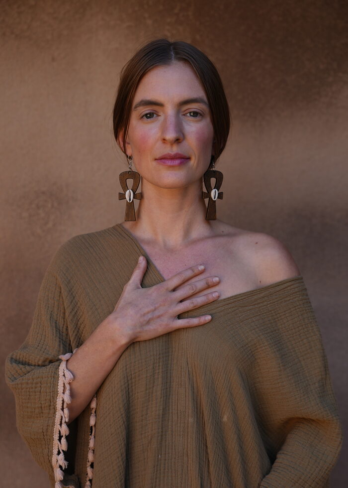 Bliss Gardner standing in ritual pose before a session